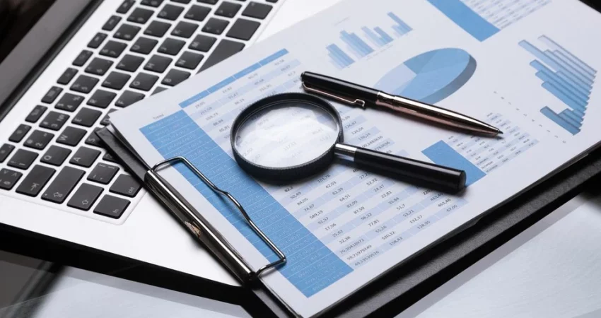 A researcher analyzing data charts and graphs, representing the process of market research.